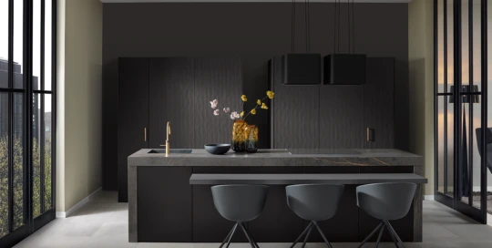 Premium handleless kitchen in dark wood veneer with gold tap and stone worktop – modern kitchen concept by pronorm.