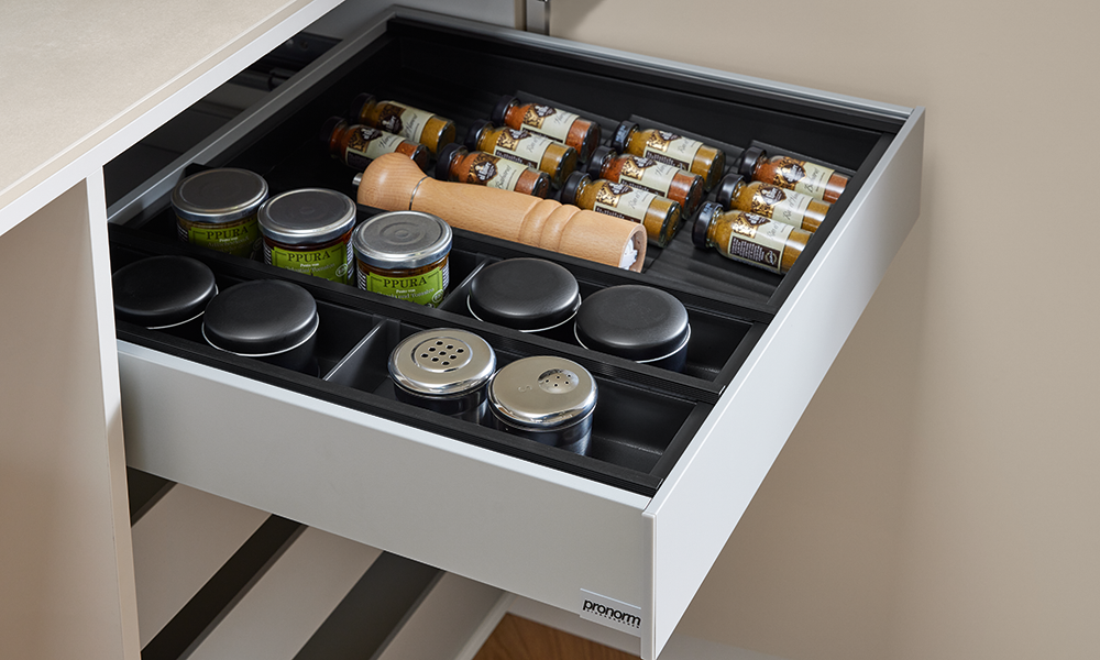 pronorm drawer with premium spice organizer, pepper mill and jars – practical and stylish kitchen storage.