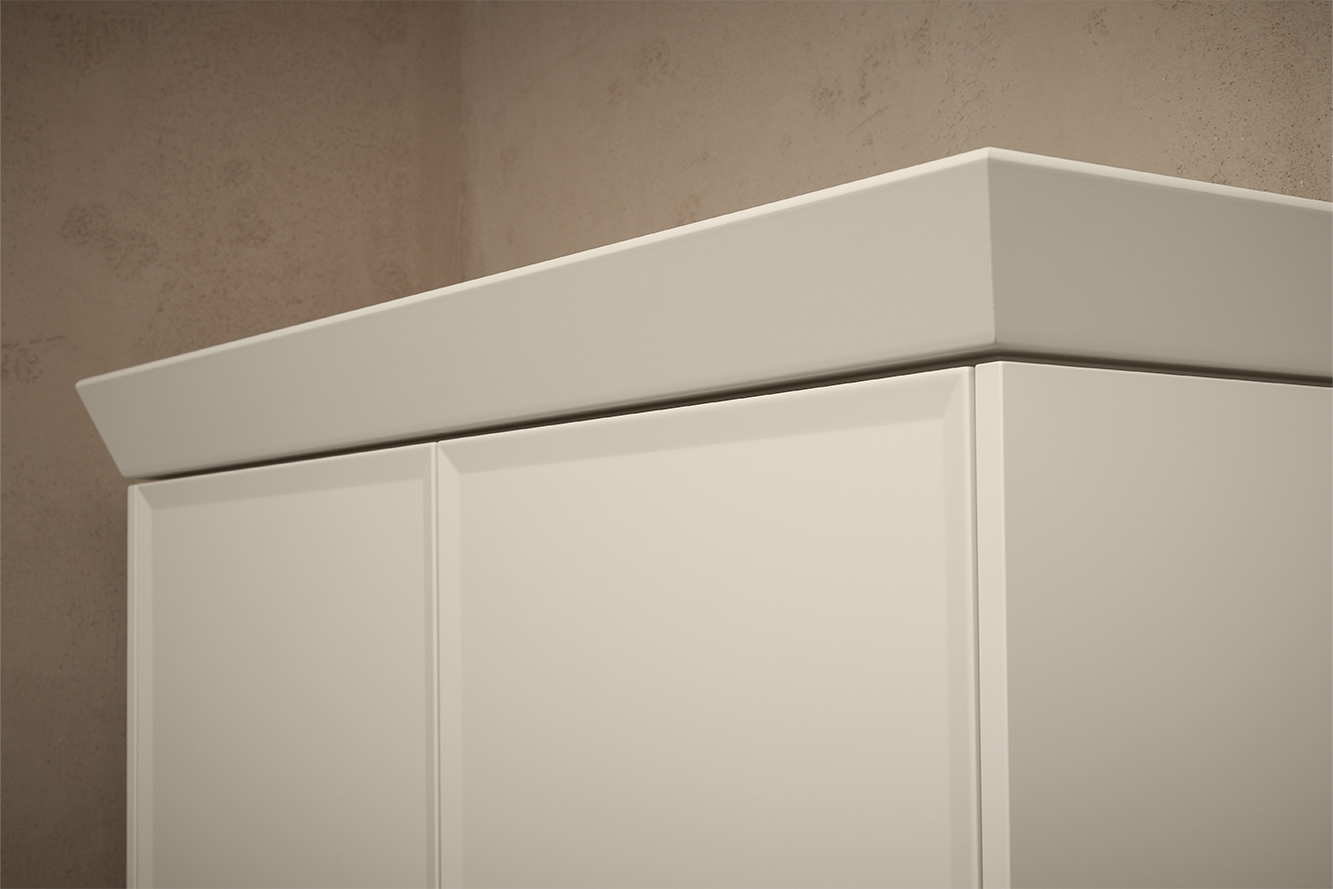 Stylish crown trim detail on upper cabinet, perfect for classic farmhouse kitchen design