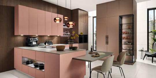 Experience the premium pink kitchen from pronorm with a built-in dining extension and top-quality finishes.