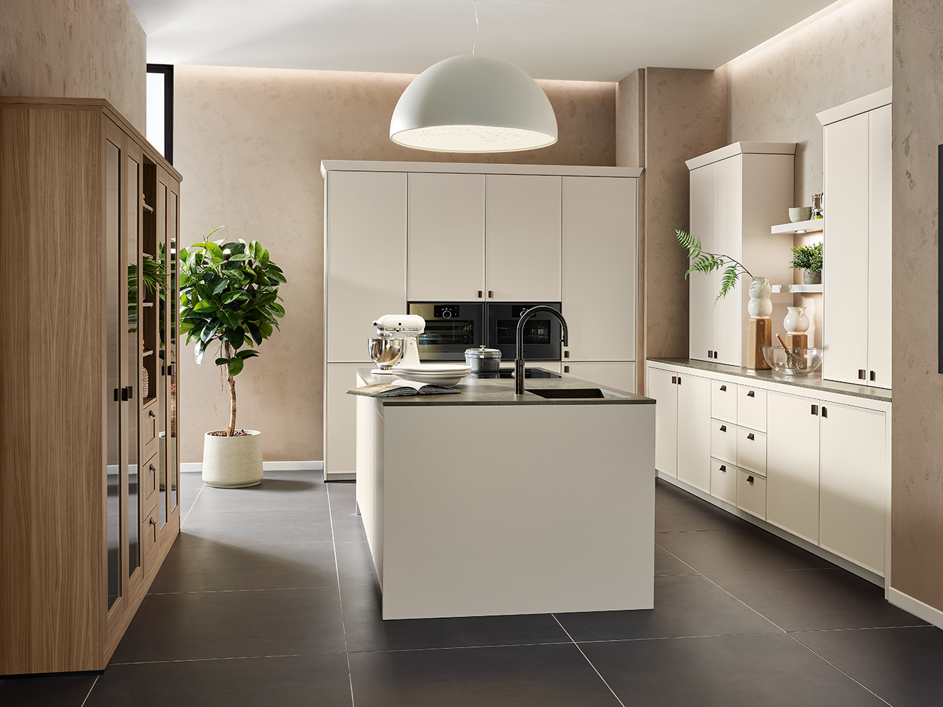 Contemporary shaker-style kitchen with central island, natural finishes and wood display unit