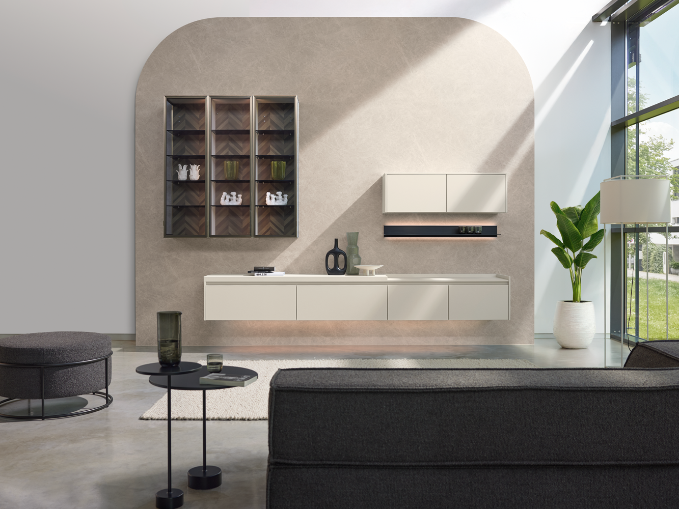 pronorm living wall with floating sideboard, glass showcase and modern lighting concept – elegant blend of function and design.