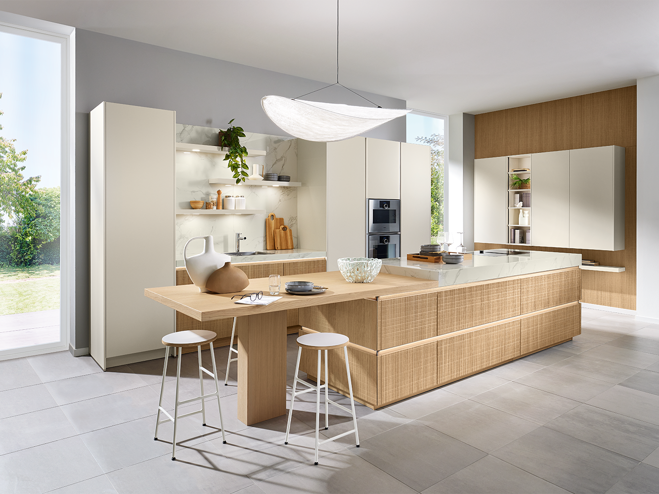 A pronorm kitchen in boho style with a distinctive veneer front and a large island with an extension table.