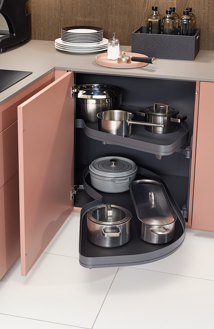 Corner carousel cabinet designed for efficient kitchen storage and easy access to cookware