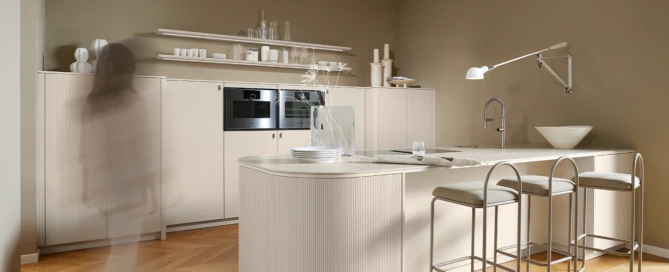 A pronorm kitchen in the trend colour 2026 with a rounded island and fluted fronts.