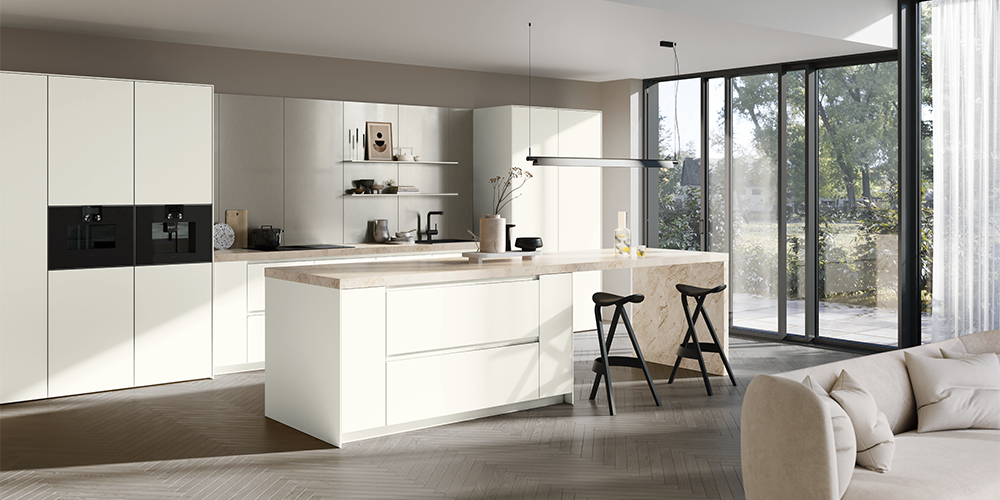 Bright white pronorm kitchen with a kitchen island and plenty of storage space.