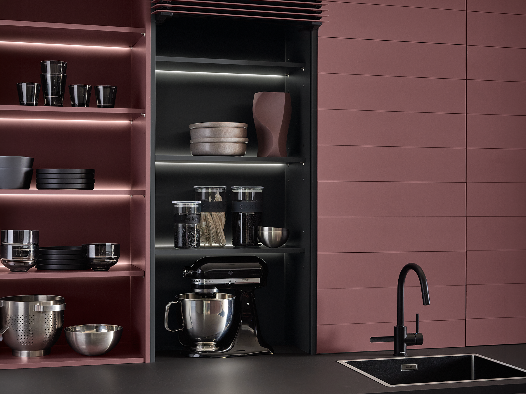 pronorm kitchen with practical flip doors fully open for quick access to hidden storage.