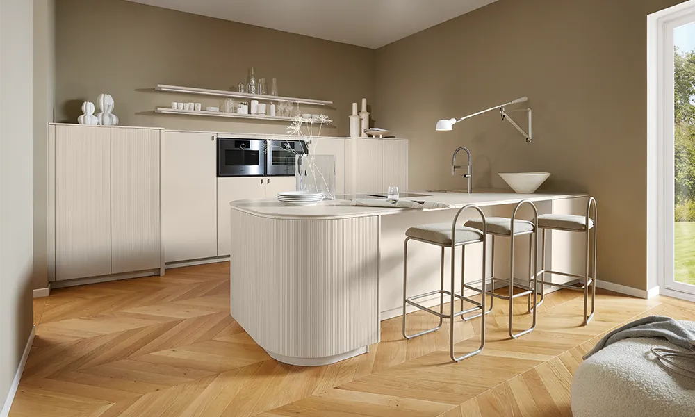 Pronorm kitchen in a consistent color, but with different kitchen front materials, ranging from a matte lacquered front to a grooved veneer front.