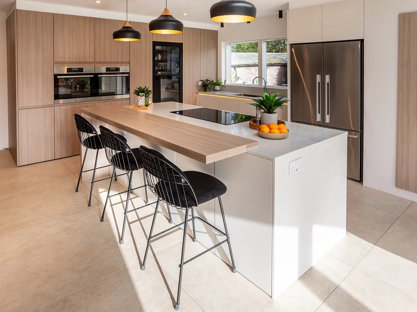 Scandinavian kitchen by pronorm with island bar for dining and socialising.