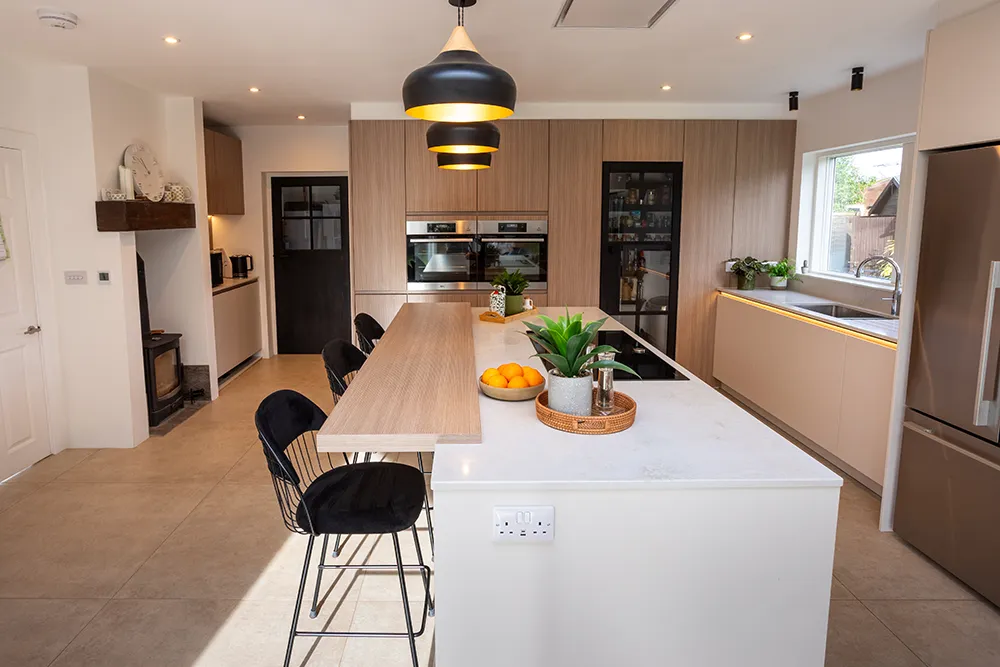 White Scandinavian pronorm kitchen with island in an open-plan living space.